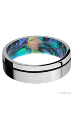 7 mm wide/Flat/14K White Gold band with one 0.5 mm Off Center inlay of Black also featuring a Abalone sleeve.