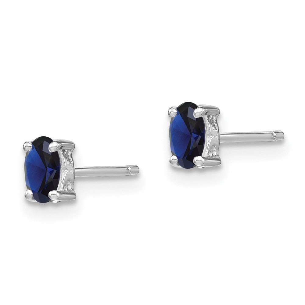 QBE29SEP Sterling Silver Rhodium-plated 5x3mm Oval Created Sapphire Post Earrings