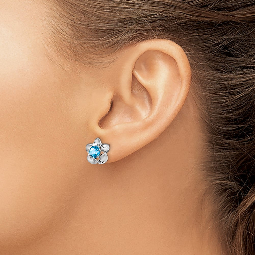 QBE31DEC Sterling Silver Rhodium-plated Floral Blue Topaz Post Earrings
