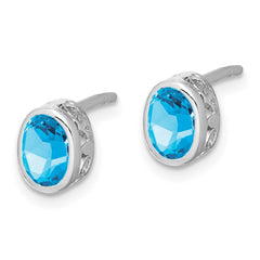 QE12626BT Sterling Silver Rhodium-plated Polished Blue Topaz Oval Post Earrings