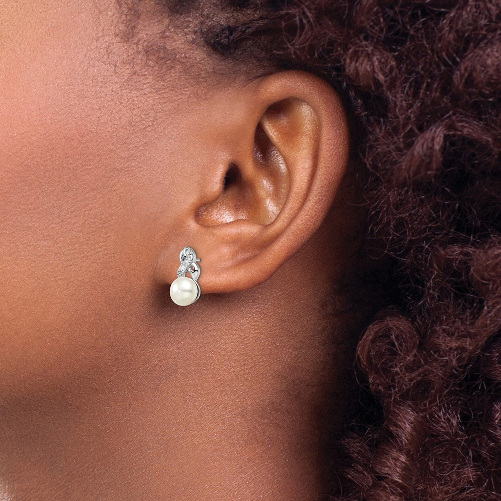 QE12814 Sterling Silver Rhodium-plated 6-7mm White Button Freshwater Cultured Pearl and CZ Post Earrings