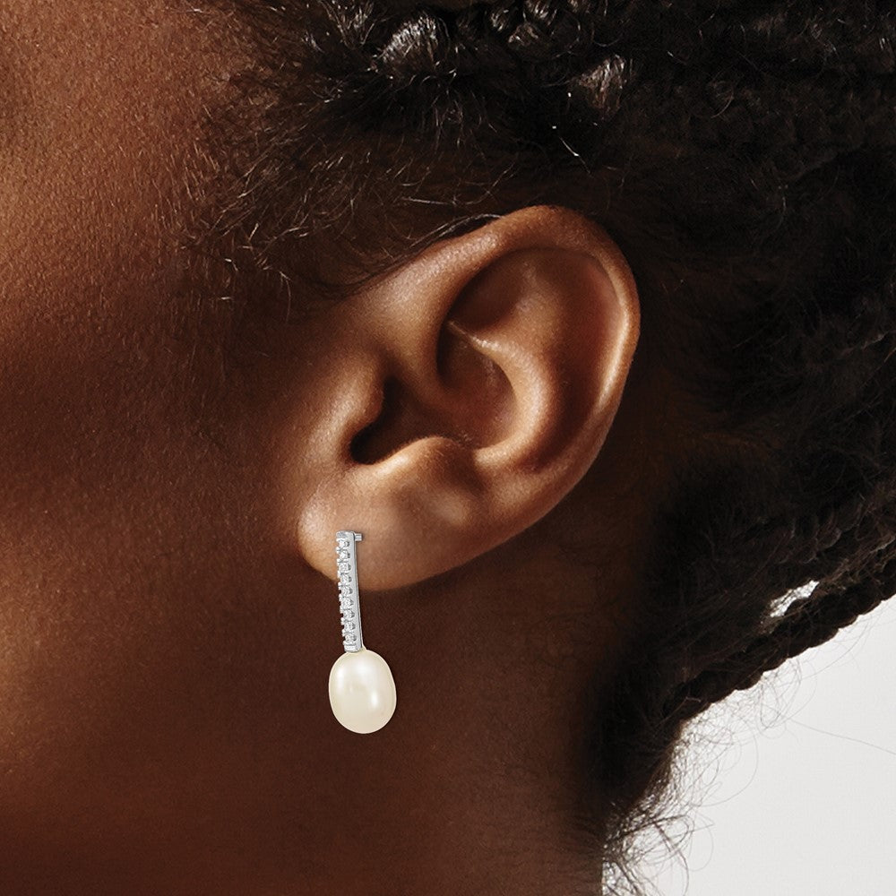 QE13866 Sterling Silver Rhodium-plated 8-9mm White Rice Freshwater Cultured Pearl and CZ Post Dangle Earrings