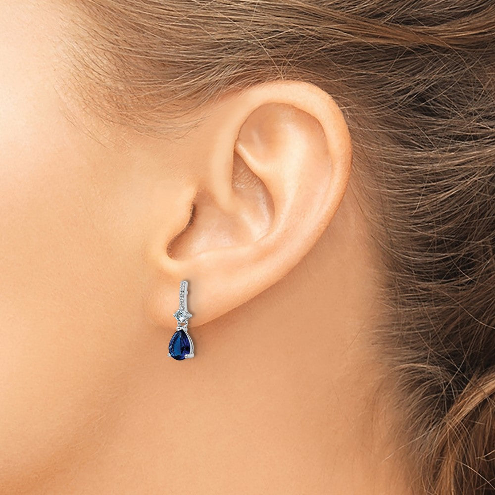 QE15742 Sterling Silver Rhodium-plated CZ and Blue Glass Post Dangle Earrings