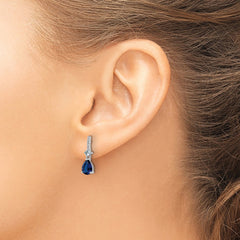 QE15742 Sterling Silver Rhodium-plated CZ and Blue Glass Post Dangle Earrings