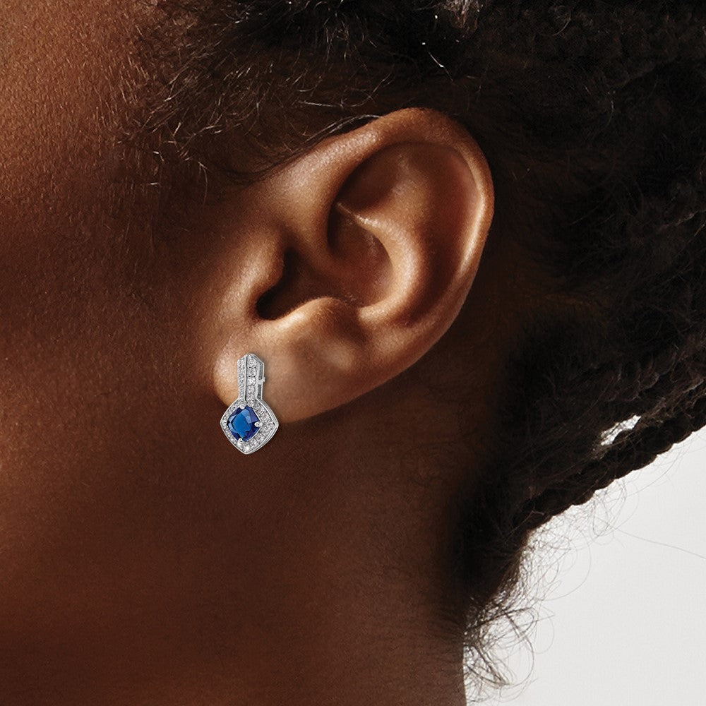 QE15745 Sterling Silver Rhodium-plated CZ and Blue Glass Post Earrings