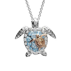 Sterling silver turtle necklace with light blue crystals and rose gold plated baby turtle