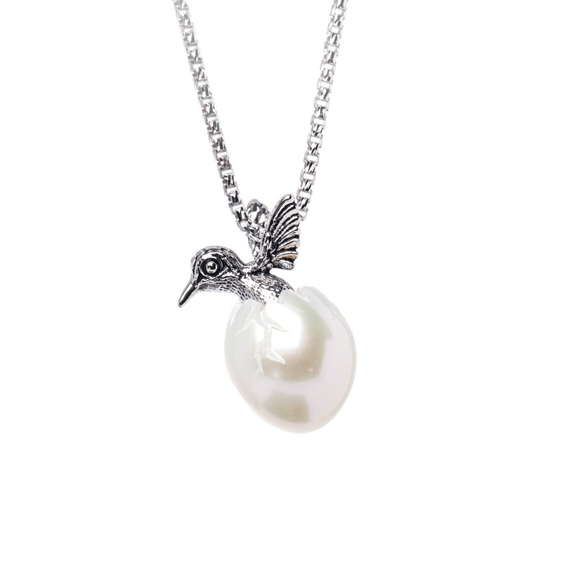 Ocean City Collection Sterling silver hatching hummingbird from pearl shell egg SS-004