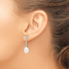 QE15213 Sterling Silver Rhodium-plated 8-9mm White Rice Freshwater Cultured Pearl and CZ Flower Post Dangle Earrings
