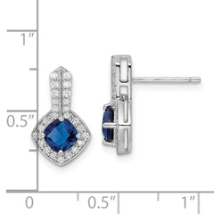 QE15745 Sterling Silver Rhodium-plated CZ and Blue Glass Post Earrings