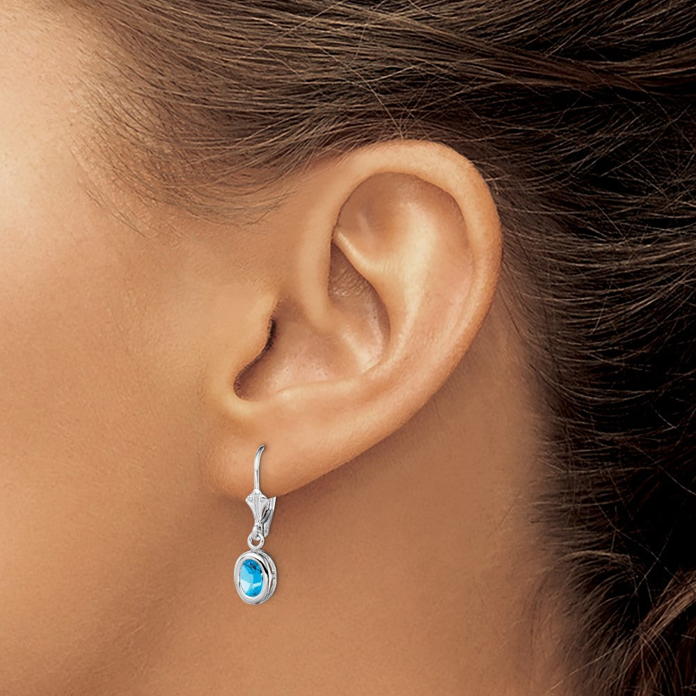 QE2043BT Sterling Silver Rhodium Plated 7x5mm Oval Blue Topaz Leverback Earrings