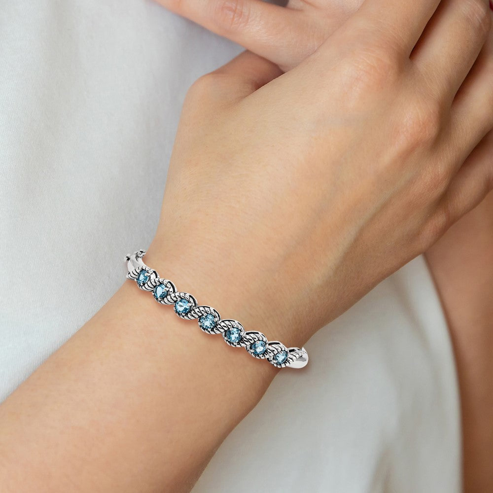 Sterling Silver Rhodium-plated Light Swiss Blue Topaz Hinged Bangle QX985BT