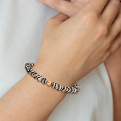 Chisel Stainless Steel Polished Rose IP-plated 6mm Black and White Striped Agate Beaded Stretch Bracelet SRB2340